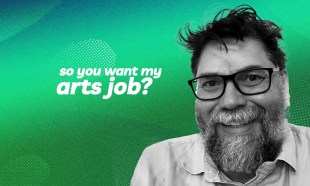 Shane Grant, La Mama Theatre’s acting Venue Technical Manager, discusses his role for the So you want my arts job? series. A dark-haired, middle-aged and fair-skinned man with a greying beard and glasses smiles for the camera against a green background.